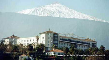 Taoro Hotel with snow capped Teide seen from San Telmo beach