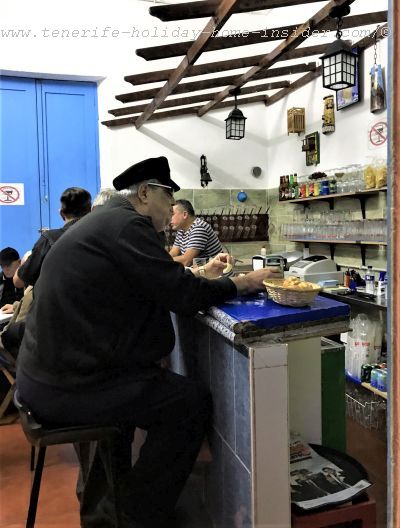 Bar of the Lyrical musical Association Pena Lunes 1965 in La Noria of Tenerife seen through an open window