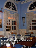 Bentwood chairs with seat cushions in a Tenerife Vegetarian restaurant.