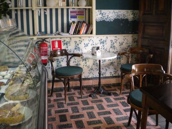 Vintage shop Ebano Cafe with art nouveau interior and paintings