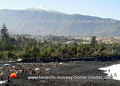 Garden beach crowned by snow capped Mount Teide