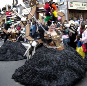 Head decorations of great size and weight and an iron-rod skirt a former allure of Carnival in Tenerife