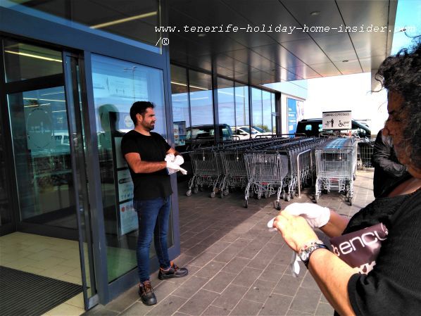 Lidl Supermarket Longuera customer education on March 16 with white gloves, distance keeping, and cueing-up outside the store to prevent crowding inside because of the Coronavirus threat Covid-19
