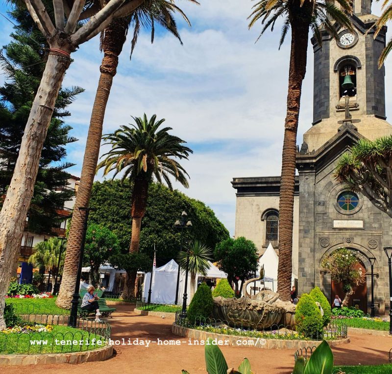 La Mueca 2025 Calle Quintana street stalls in white tents on the big church Place