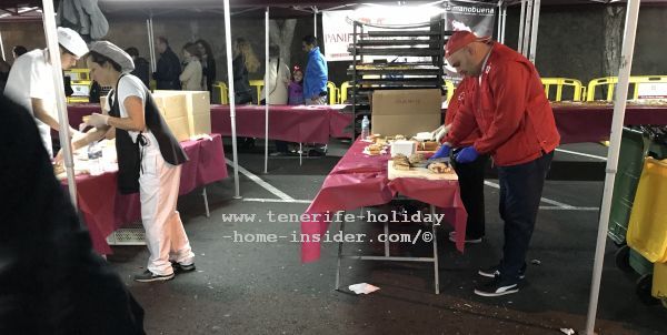Charity workers are preparing Roscon de Reyes on site in a Fiesta tent of La Orotava