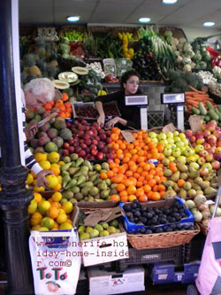 An unusual pyramid display scheme for plywood boxes with fresh produce stacked up very high