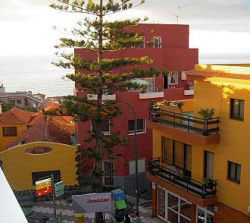 Edificio in red and small casona house