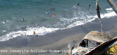 Swimmers and surfers playa el arenal Tenerife 