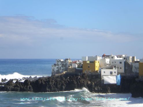 Tenerife weather El Bravo effect on Punta Brava by Puerto de la Cruz as seen by the tall grey and white building